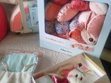 two boxes with stuffed animals in them sitting on the floor