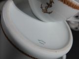 a cup and saucer sitting on top of each other