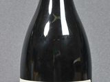 a bottle of wine that is sitting on a table