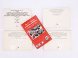 three open books sitting on top of each other on top of a table