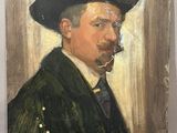 portrait of a man with a pipe in his mouth and a hat on his head