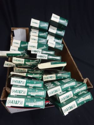 a box full of boxes of cigarettes on a black background