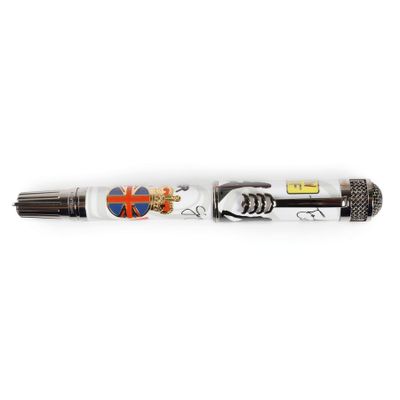a close up of a pen on a white surface with a flag on it