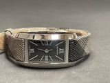 a silver watch with a black face on a silver bracelet