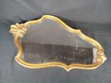 a mirror that is sitting on a black cloth