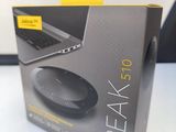 the box of the speaker is open on the table