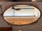 a mirror that is sitting on a table in a room