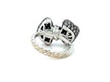 two rings with black and white diamonds on them on a white surface