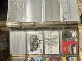 a lot of cassettes stacked on top of each other