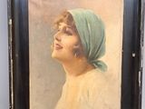 painting of a woman with a green head scarf in a black frame