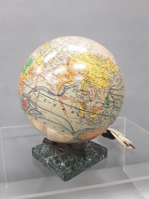 a globe on a stand with a map on it
