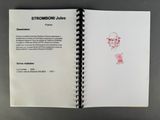 an open notebook with a drawing of a man on it