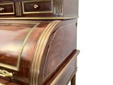 a wooden desk with a drawer on top of it