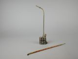 an old toothbrush and a toothbrush holder on a white surface