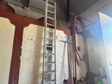 a ladder that is leaning against a wall in a room