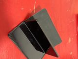 a red wall with a black phone on it