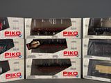 six boxed boxes of piko model trains sitting on top of each other