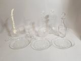 a lot of glass items that are on a table
