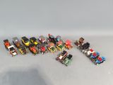 a lot of toy vehicles that are sitting on a table