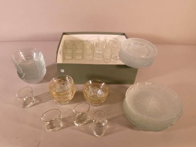 a lot of glassware sitting on a table next to a box