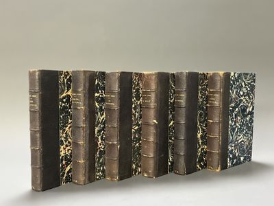 a stack of books sitting on top of each other on a table