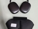 an image of a pair of black headphones and a case