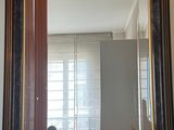 a mirror hanging on the wall in a room
