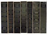 a set of five books with black covers and gold lettering