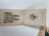 an open book with a picture of a castle on it