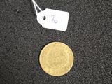 a gold coin with a price tag next to it