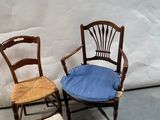 two chairs that are next to each other on the floor