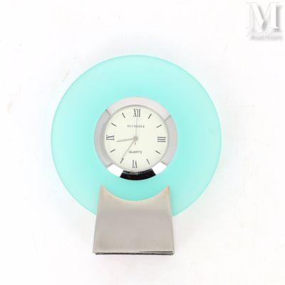 a clock that is sitting on top of a stand