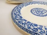 many plates that are sitting on a table