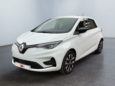 the white car is parked in a room with a black floor