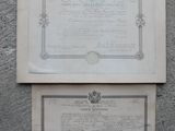 two old papers on the wall with a picture of a crown