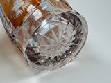 a glass vase that is sitting on a table