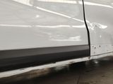 a white car with a black stripe on the side of it