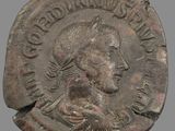 une image d'une pièce de monnaie sur laquelle figure le visage d'un homme