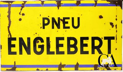 un panneau jaune et noir sur lequel est inscrit « pneu englebertt »