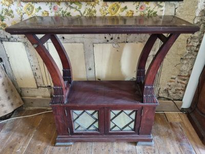 a wooden table with a mirror on top of it