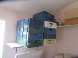 many boxes stacked on top of each other in a room