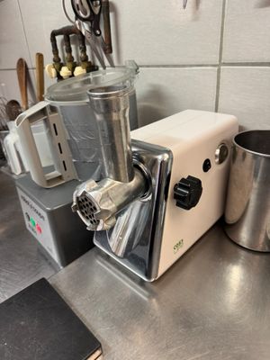 a blender sitting on a kitchen counter next to a pot