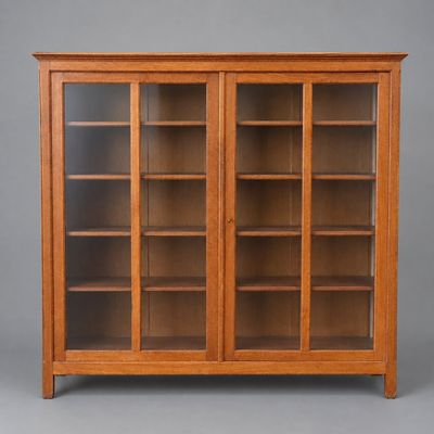 an oak bookcase with glass doors and shelves