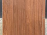 a close up of a piece of wood with a black background