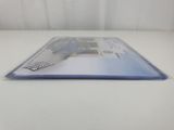 a close up of a book on a table with a white background