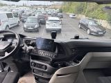 a view from inside a vehicle of a lot of cars