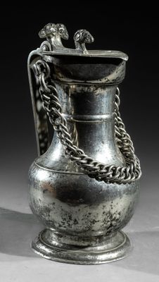 a silver vase with a chain on the handle