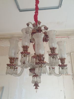 a chandelier hanging from the ceiling in a room