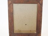 an old wooden easel with a painting on top of it