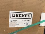 a cardboard box with a green ribbon tied to it